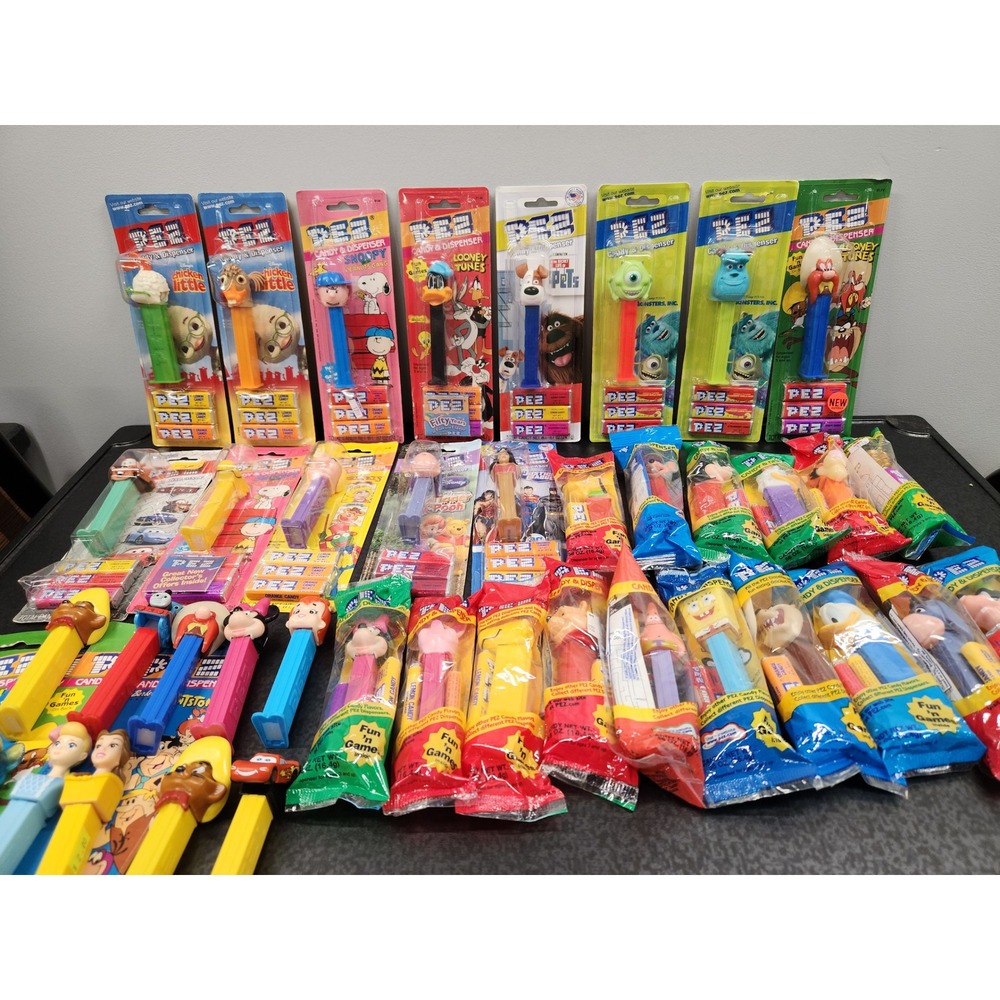 39 Vtg PEZ Dispensers Lot Disney Looney Tunes Peanuts Muppets Pixar DC‎ Unopened
